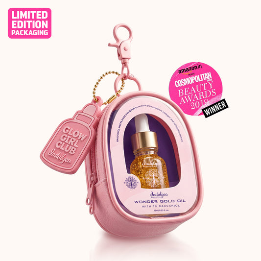 Indulgeo Essentials Wonder Gold Oil 15ml with 1% Bakuchiol in pink limited edition pouch with Glow Girl Club tag and award badge