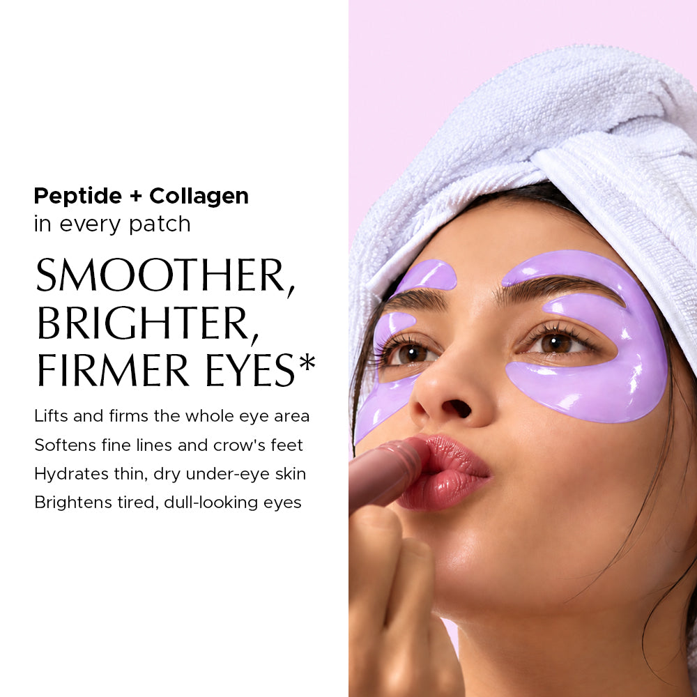 Woman wearing purple E-shaped hydrogel eye patches under eyes and on eyelids with white towel wrapped on head applying lip balm